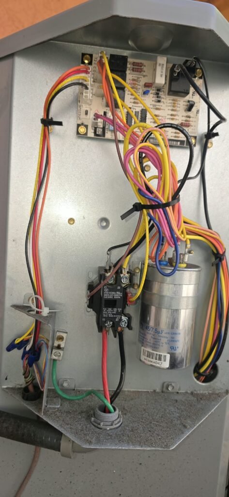 HVAC Electrical Panel During Tune-Up in Palm Harbor, FL 34683 Open electrical panel in HVAC unit during tune-up in Palm Harbor, FL 34683