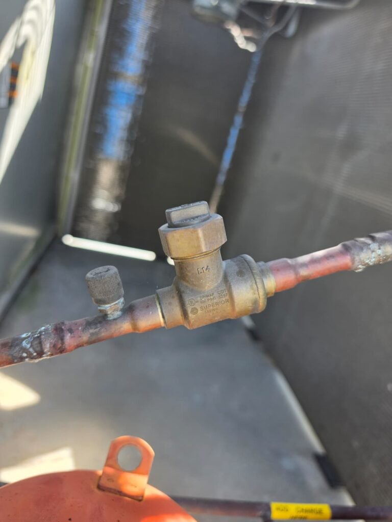Close-up of HVAC line valve during service in Brandon, FL 33511