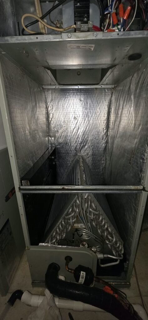 Open HVAC system showing coils during service in Tampa, FL 33615