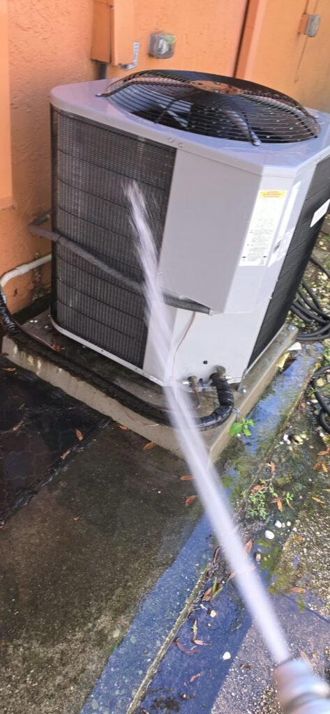HVAC Unit Cleaning in Palm Harbor, FL 34683 HVAC unit cleaning with water hose in Palm Harbor, FL 34683