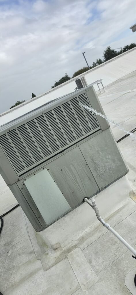 HVAC Unit on Rooftop with Side Water Spray in Wesley Chapel, FL 33543 HVAC unit on rooftop with side water spray in Wesley Chapel, FL 33543
