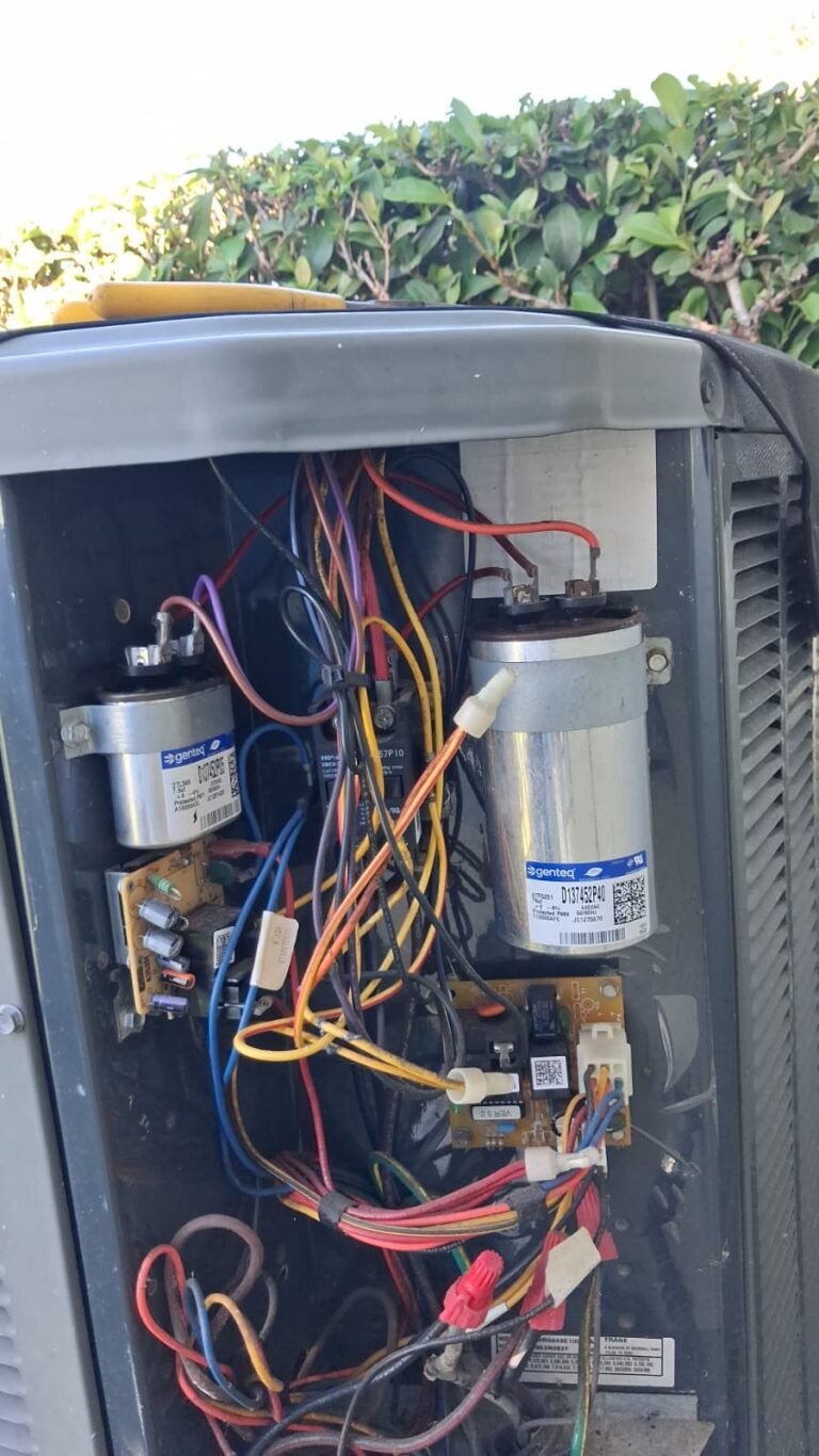 HVAC unit with exposed wiring during capacitor replacement in Wesley Chapel, FL 33544
