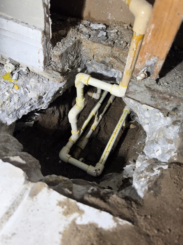 In-Progress Slab Leak Repair in Brandon, FL 33511 In-progress slab leak repair showing exposed pipes in Brandon, FL 33511