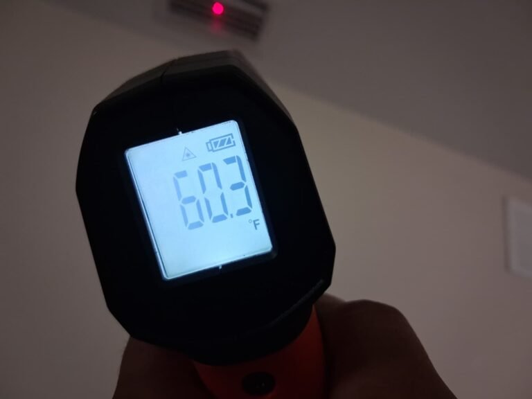 Infrared thermometer reading 60.3°F near vent, Tampa, FL 33603