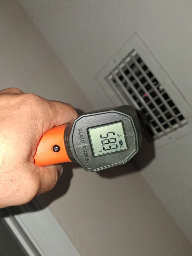 Infrared thermometer reading 58.9°F near vent, Tampa, FL 33603