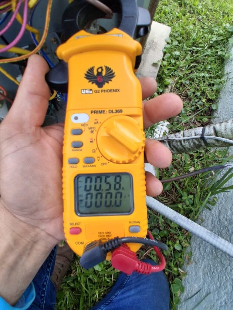 Using multimeter during HVAC repair in Odessa, FL 33556