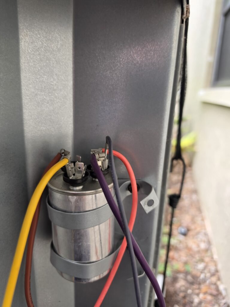 New Capacitor on HVAC Unit, Tampa, FL 33624 Close-up of new capacitor on HVAC unit in Tampa, FL 33624
