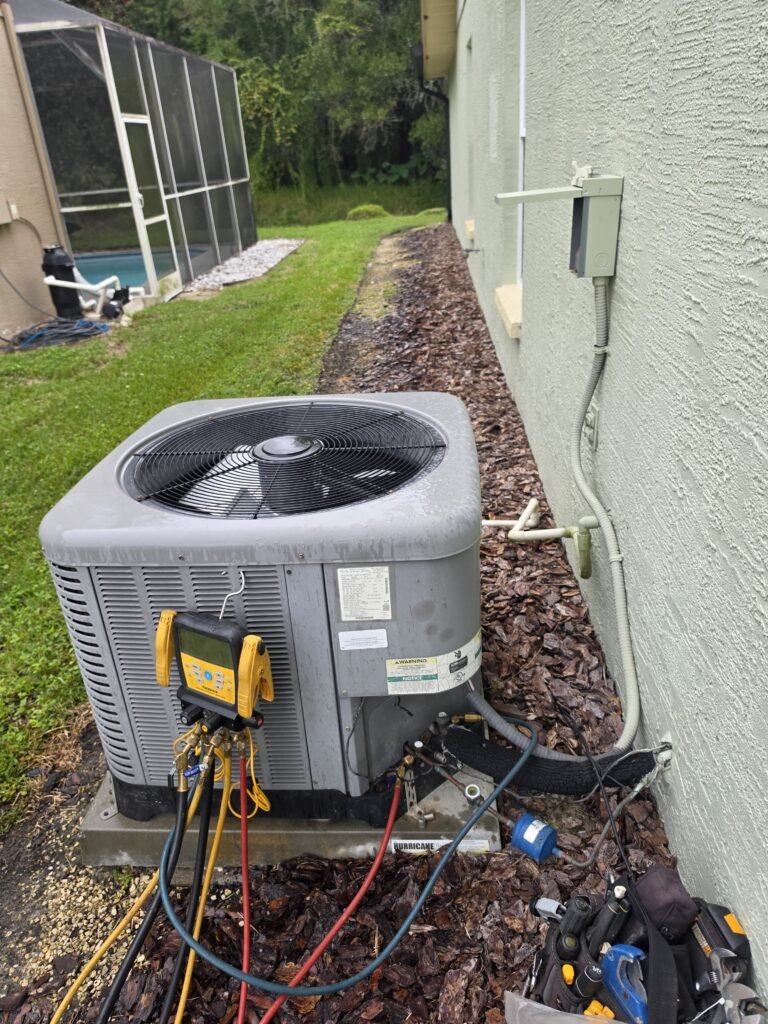 Outdoor HVAC unit with tools attached in Land O Lakes, FL 34639