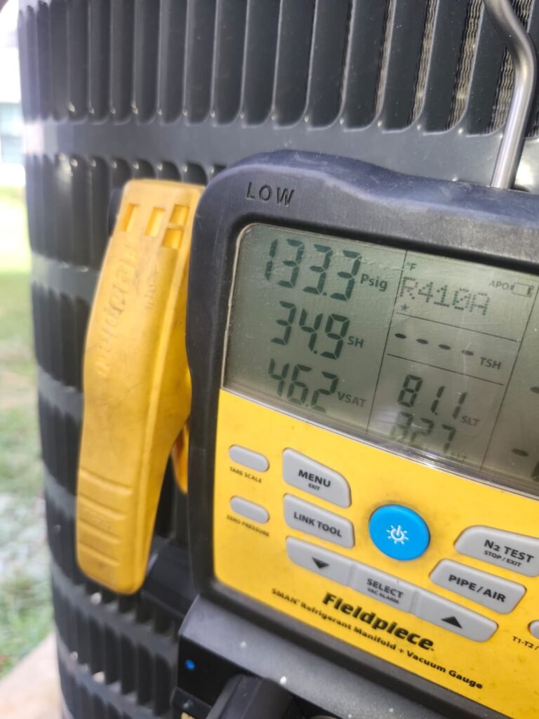 Digital manifold gauge showing pressure readings in Clearwater, FL 33762