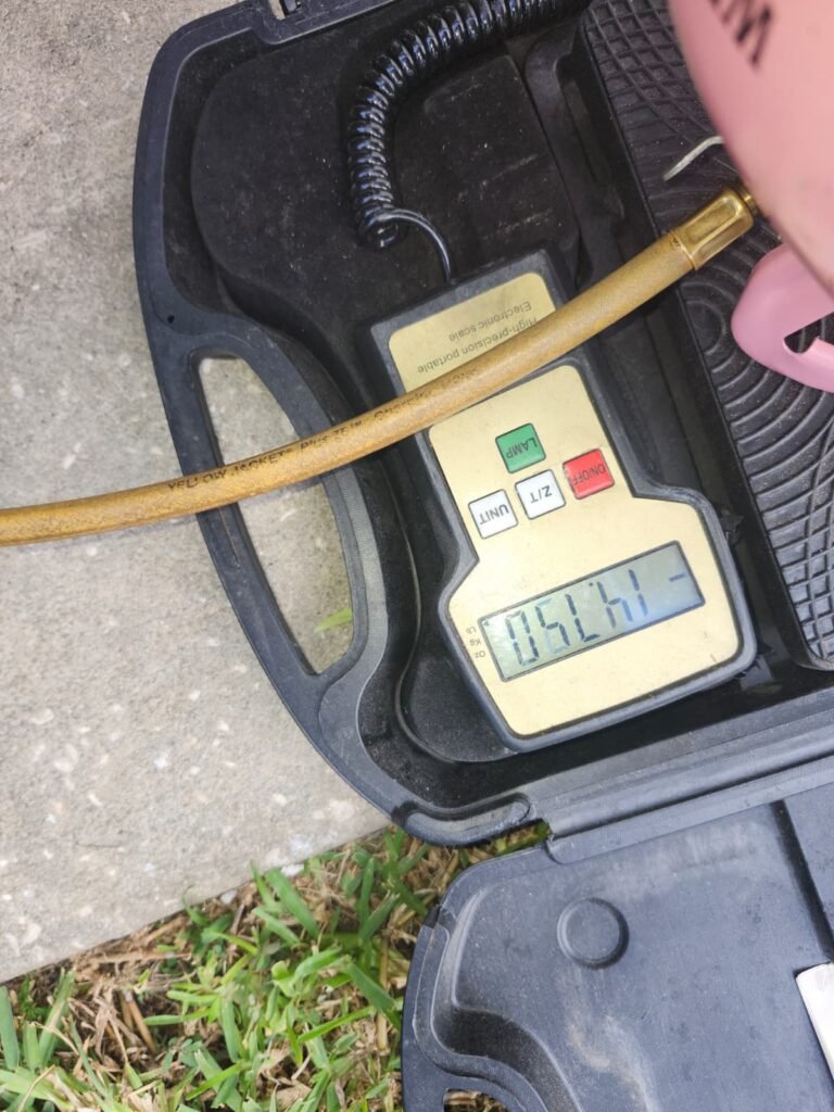 Refrigerant Weight Measurement in Tampa, FL 33635 Digital scale measuring refrigerant weight in Tampa, FL 33635