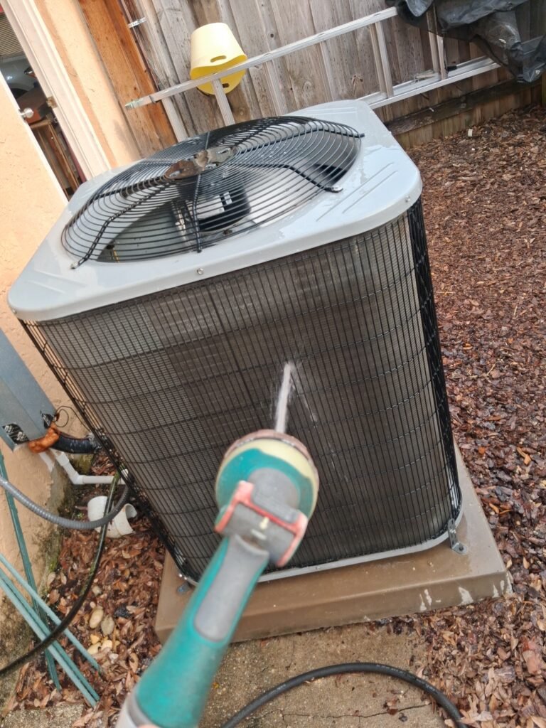 Rinsing Outdoor HVAC Unit in Tampa, FL 33617 Rinsing outdoor HVAC unit in Tampa, FL 33617