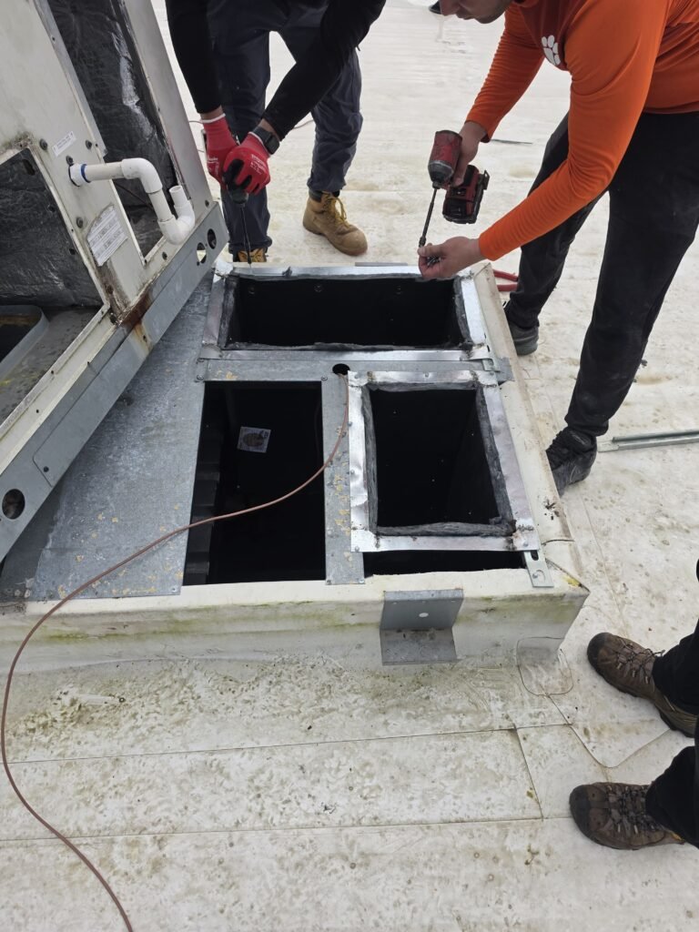 Technicians installing ducts on rooftop, Riverview, FL 33579