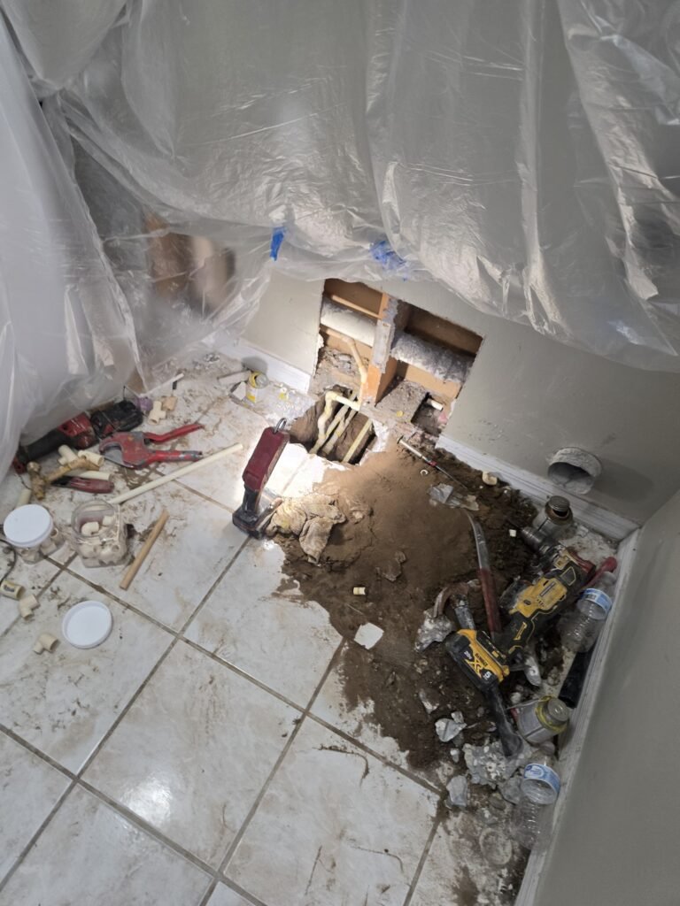 Room with Floor Hole and Tools in Brandon, FL 33511 Room with floor hole and tools during repair in Brandon, FL 33511