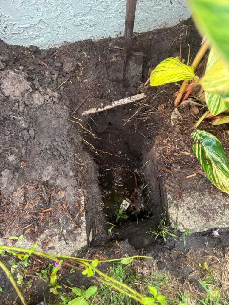 Dug hole for sewer inspection near house in Tampa, FL 33624