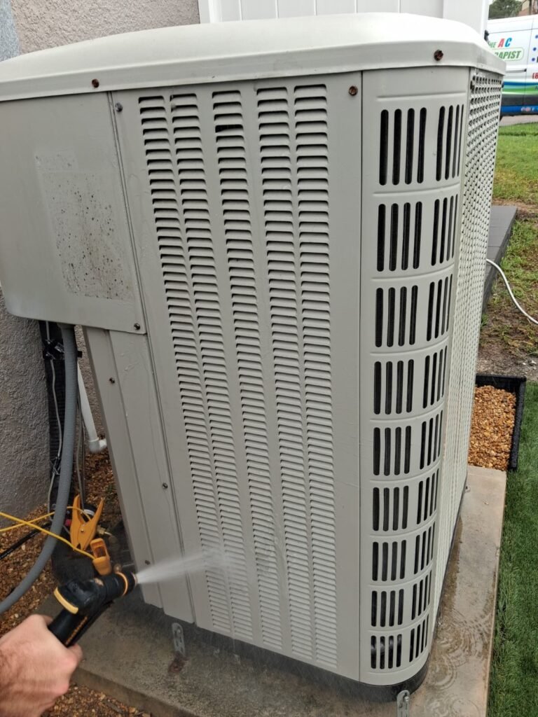 Technician cleaning HVAC unit in Palm Harbor, FL 34683