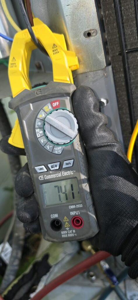 Technician using multimeter on HVAC wiring, Pinellas Park, FL 33782