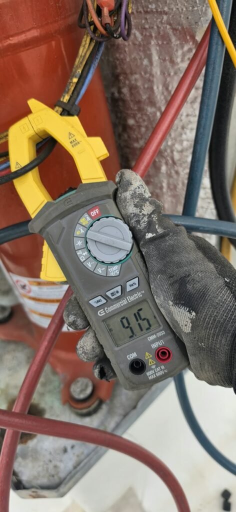 Technician Using Multimeter on HVAC Wiring in Wesley Chapel, FL 33543 Technician using multimeter on HVAC wiring in Wesley Chapel, FL 33543