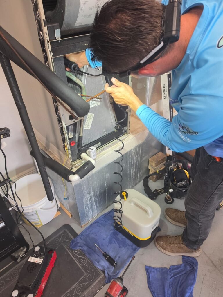 Technician servicing air handler in Palm Harbor, FL 34683