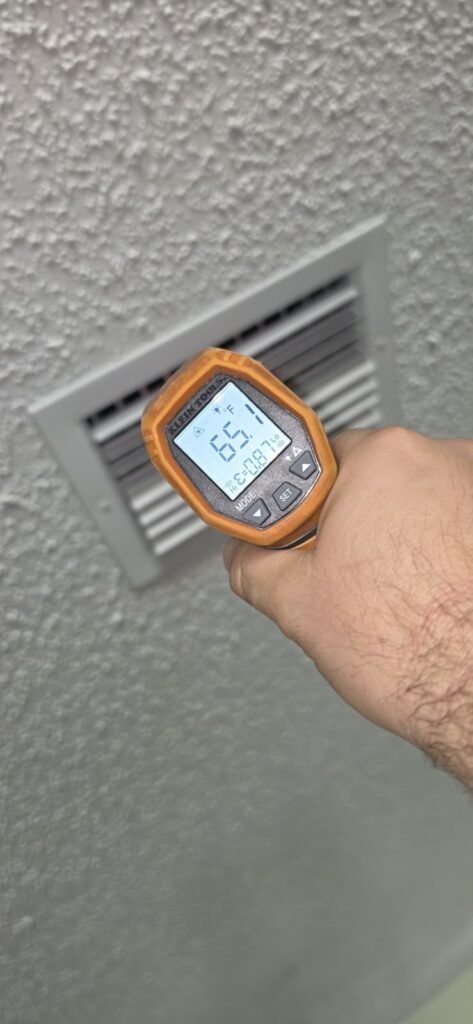 Temperature Check Near Air Vent in Palm Harbor, FL 34683 Temperature reading near air vent during AC check in Palm Harbor, FL 34683