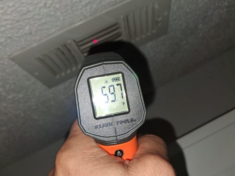 Infrared thermometer showing 59.7°F near vent in Brandon, FL 33511