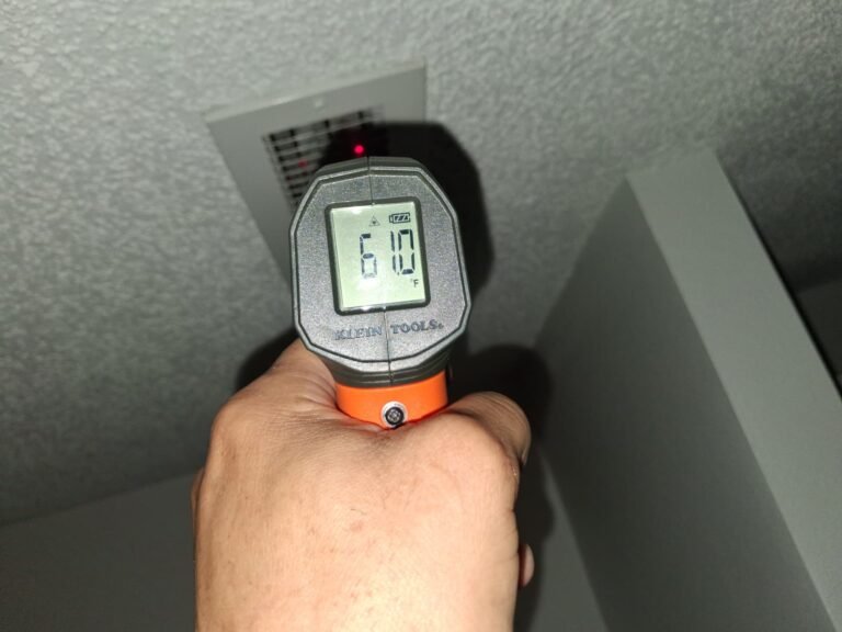 Infrared thermometer showing 61.0°F near vent in Brandon, FL 33511