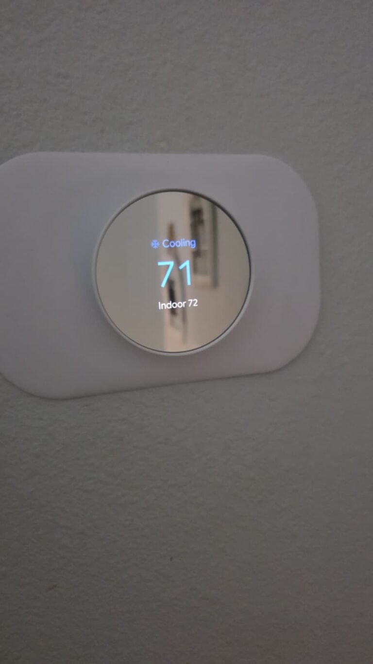 Digital thermostat showing temperature in Tampa, FL 33625