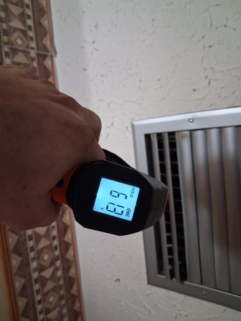 Vent Temperature Check in Tampa, FL 33617 Temperature measurement at vent during HVAC service in Tampa, FL 33617