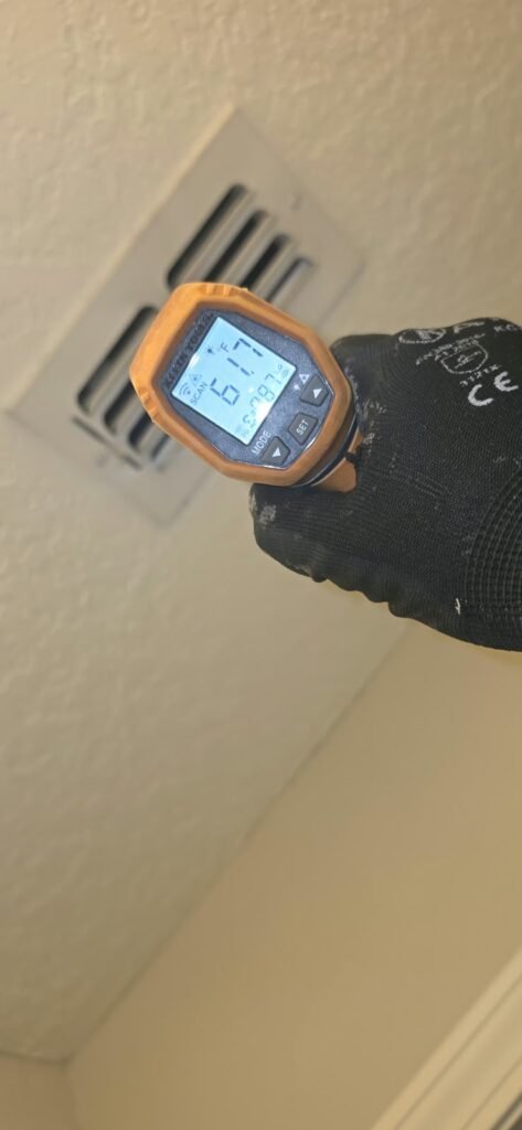 In-progress: technician measuring vent temperature, Lutz, FL 33558