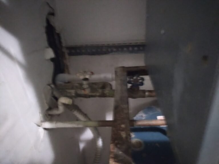 Partially visible water heater with pipes in St. Petersburg, FL 33713