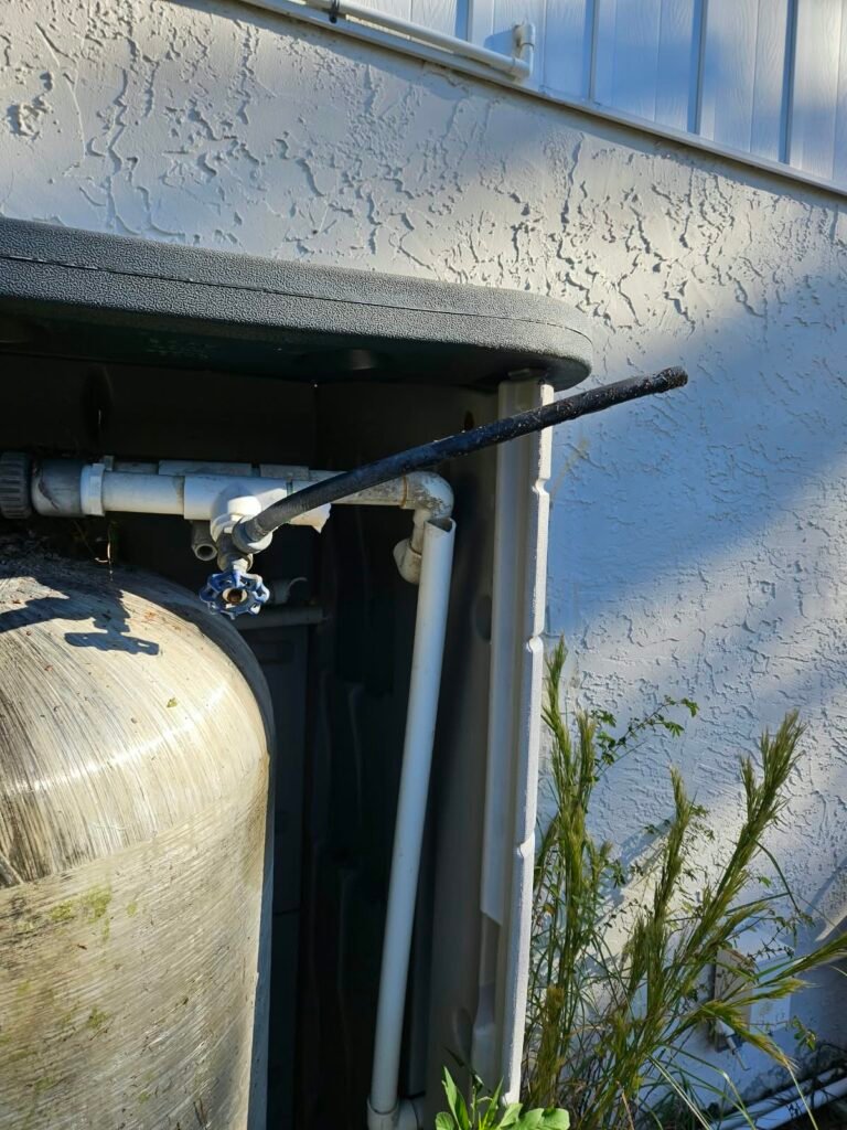 Water Tank with PVC Pipes Next to Wall in Hudson, FL 34667 Water tank with PVC pipes next to wall in Hudson, FL 34667