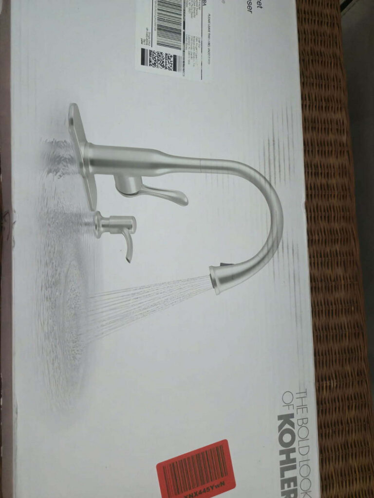 a kohler kitchen faucet displayed in packaging with a focus on modern design features and installation components visible