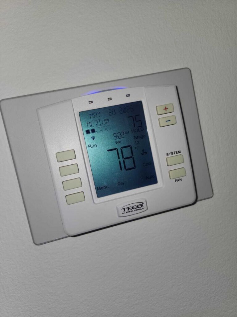 From one of our recent jobs: a thermostat displaying a temperature of seventy-five degrees with settings for cooling and fan options visible.