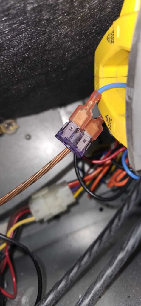 electrical connections being inspected or repaired within an appliance possibly related to heating or cooling systems