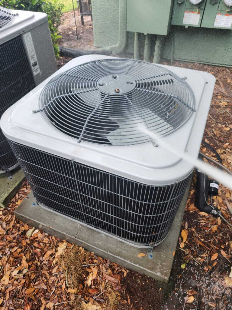 home therapist cooling heating and plumbing cleaning an outdoor air conditioning unit with water and possibly a cleaning solution
