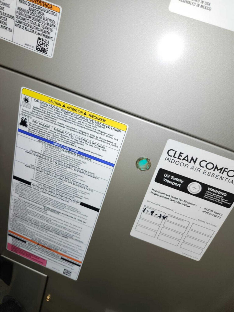 home therapist cooling heating and plumbing installing or servicing an indoor air quality system with multiple informational labels visible