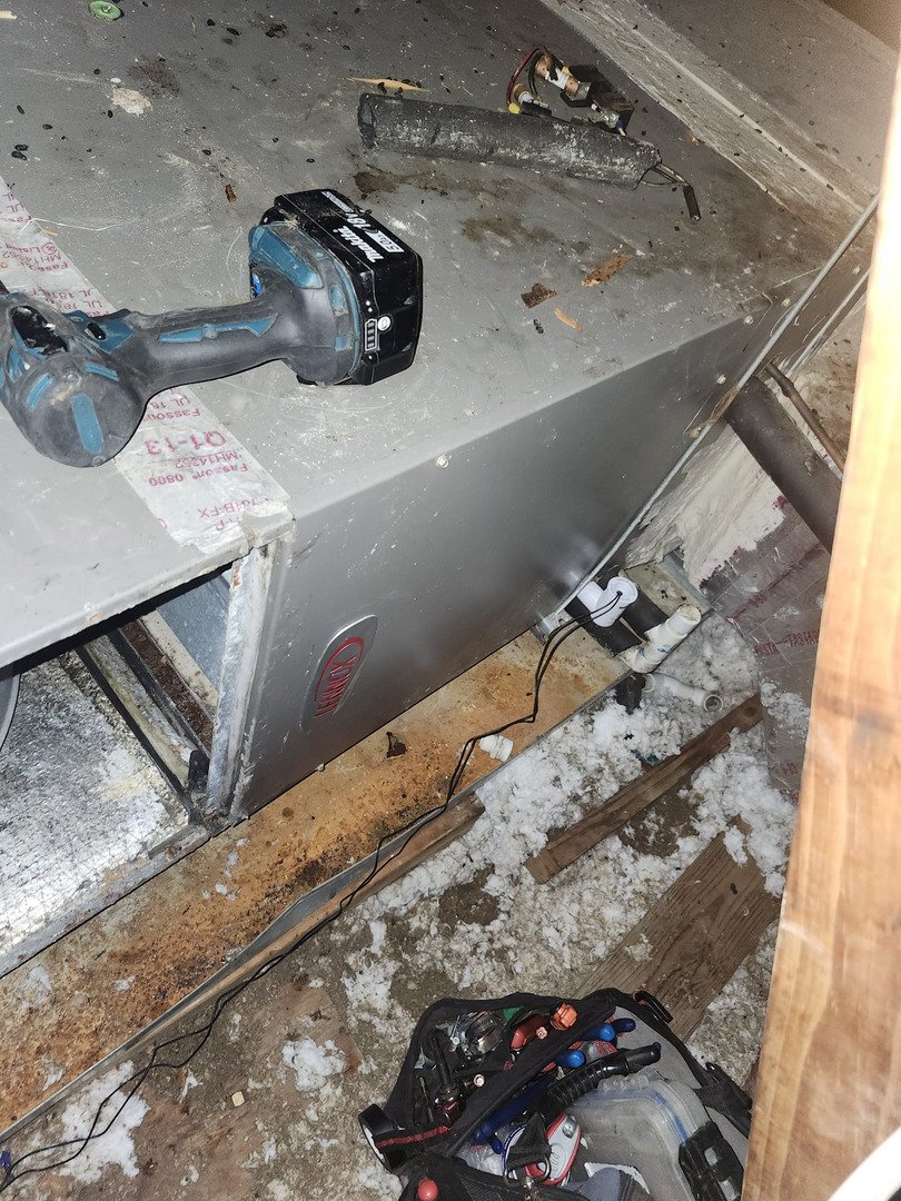 Home Therapist Cooling Heating And Plumbing Repairing Or Maintaining An Air Conditioning Unit With Tools And Debris Visible Around