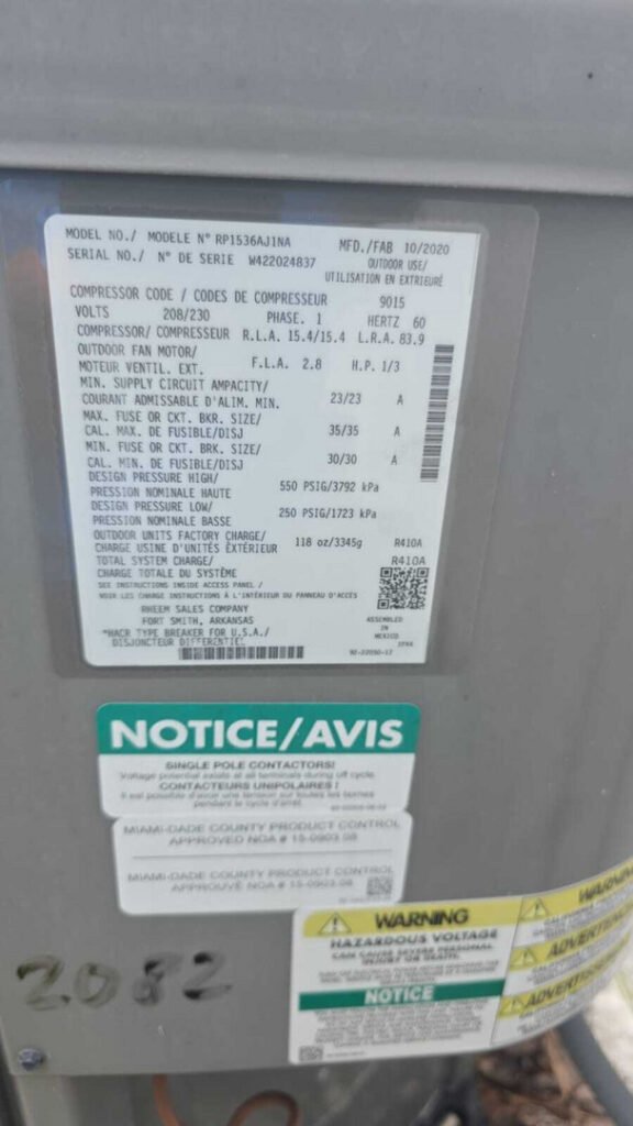 labels on an outdoor heating and cooling unit showing model specifications and safety warnings