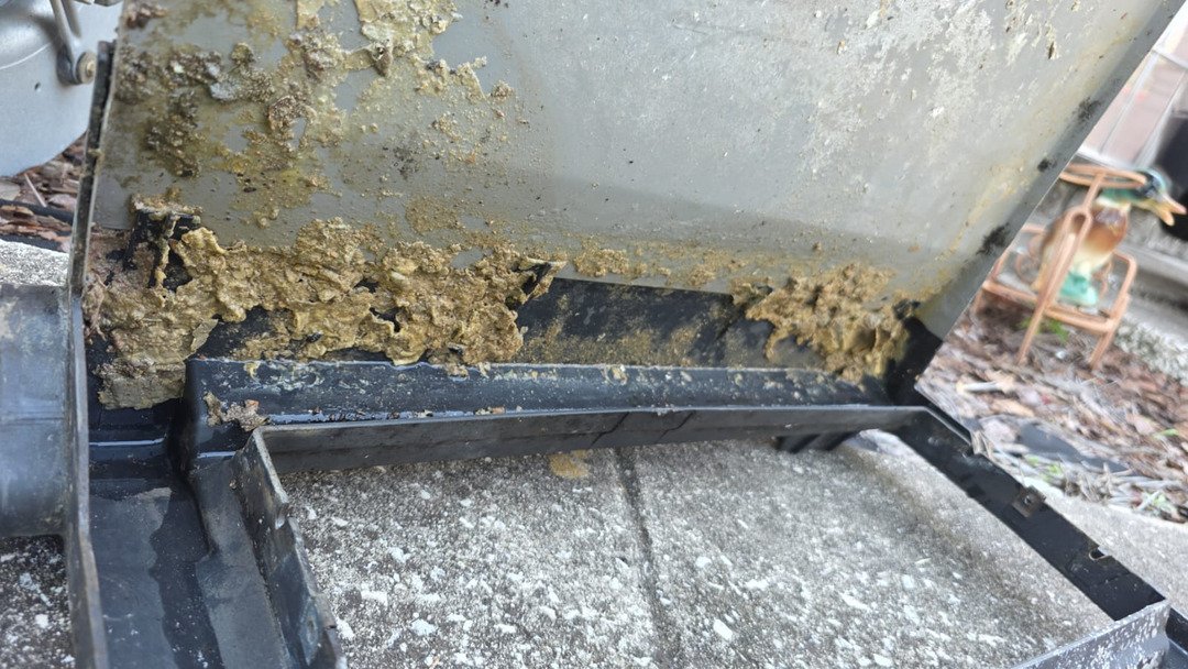 thick residue buildup on a cooling or heating unit indicating potential maintenance or cleaning service needed
