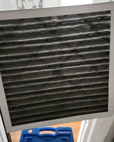 Dirty Air Filter On Blue Step Stool In Living Room Tampa Fl
